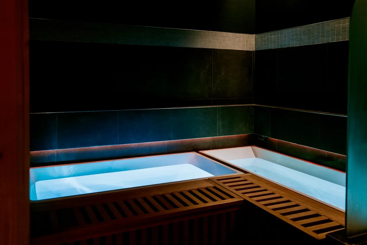 The cold plunge, lit blue