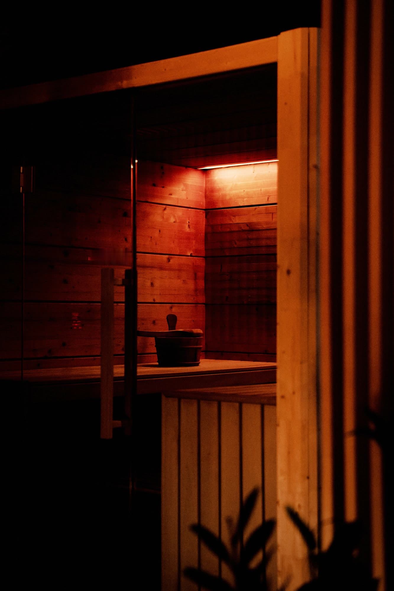 The cedar room at Elahni, held low and lit warm along one edge