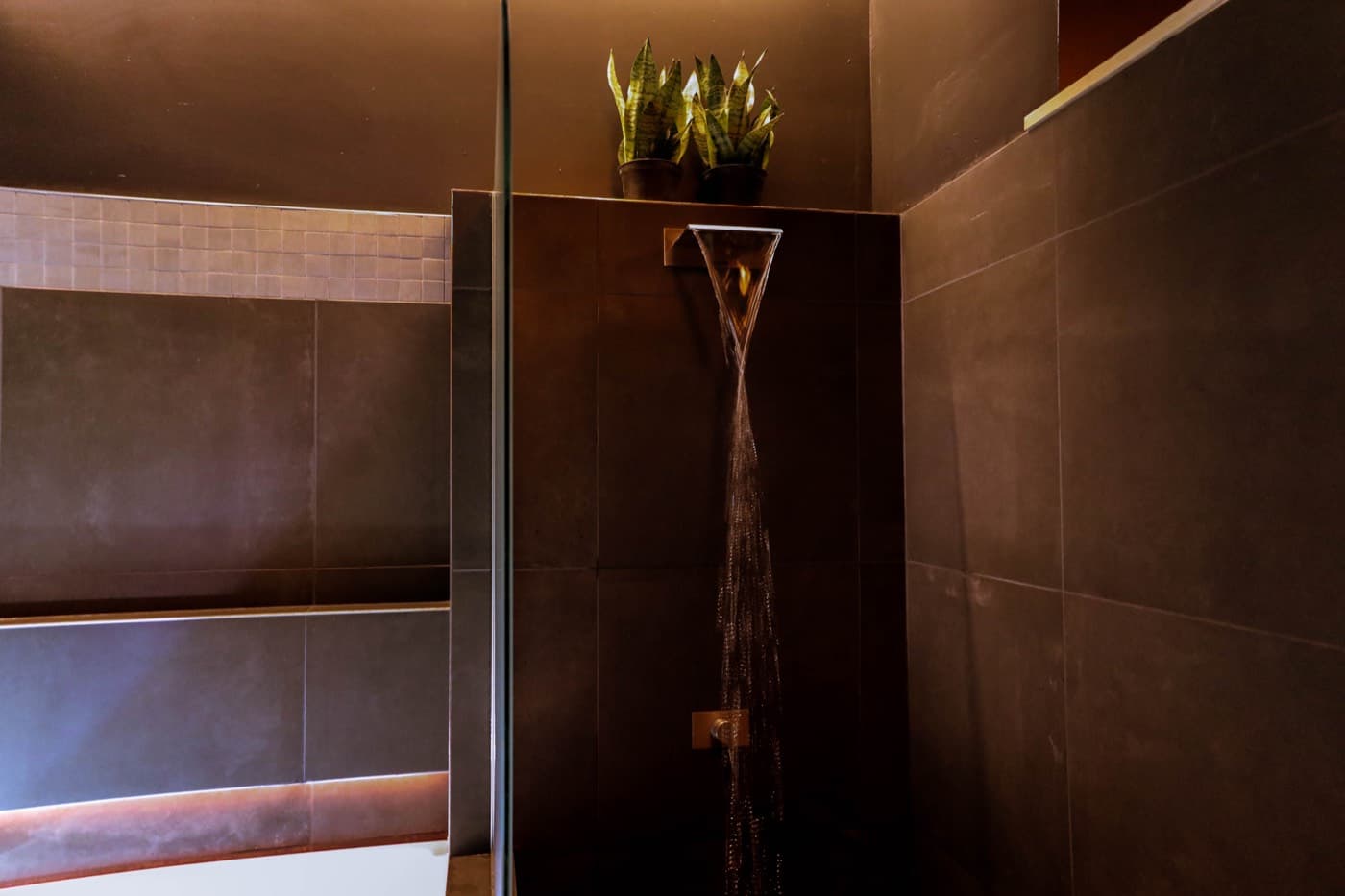 The rain shower at Elahni, a ribbon of water falling through the dark
