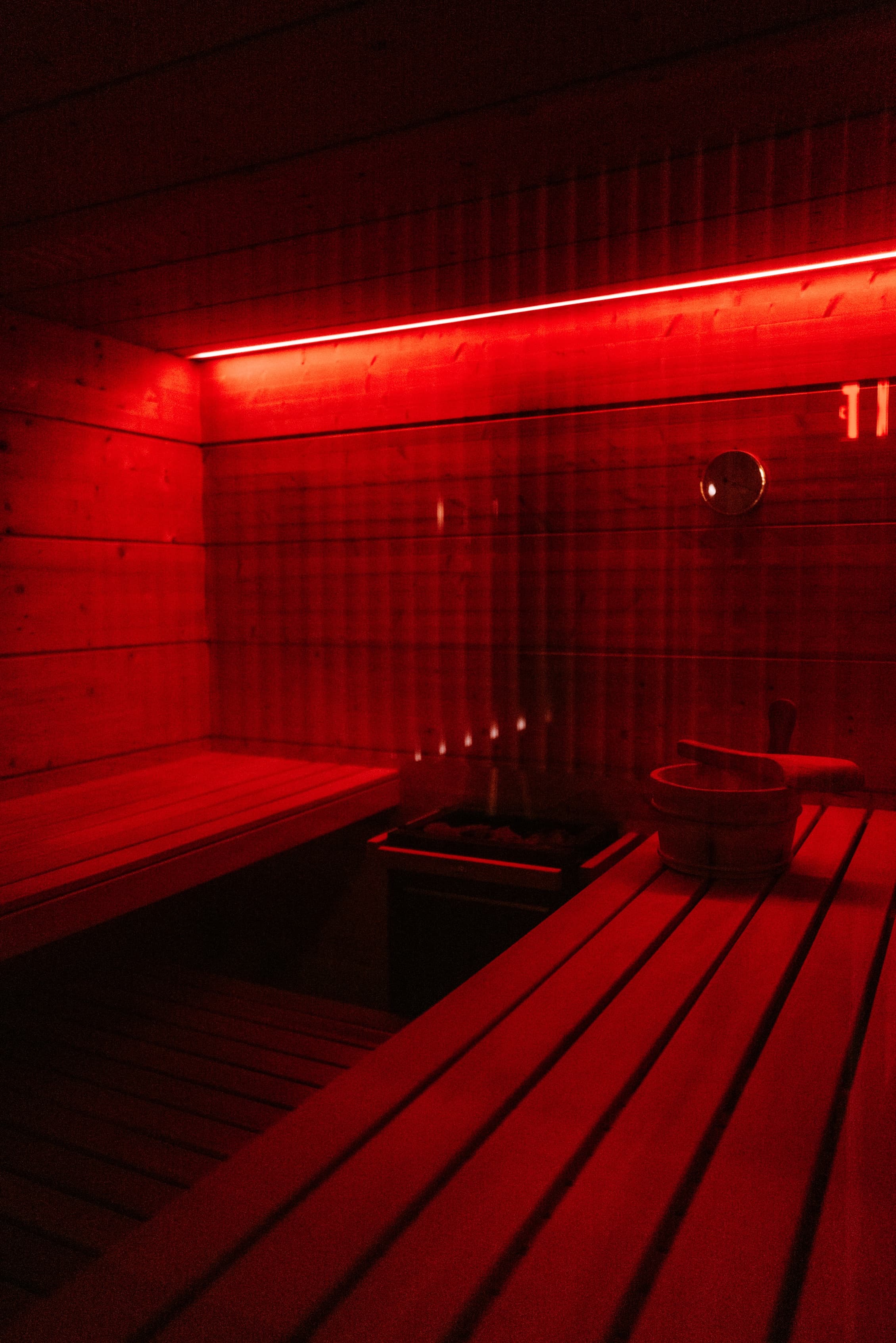 The cedar sauna in low red light